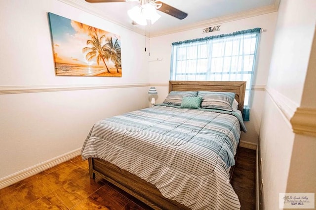 bedroom with ornamental molding and ceiling fan