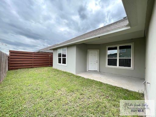 exterior space with a yard and a patio