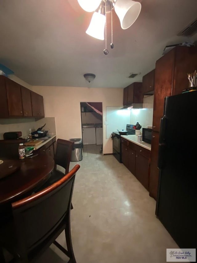 kitchen with dark brown cabinets and black appliances