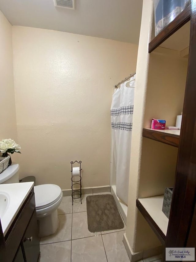 bathroom featuring tile patterned flooring, vanity, toilet, and a shower with curtain