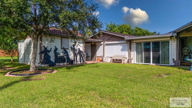 238 Starcrest Dr, Brownsville, TX 78521 - rear view of house featuring a yard