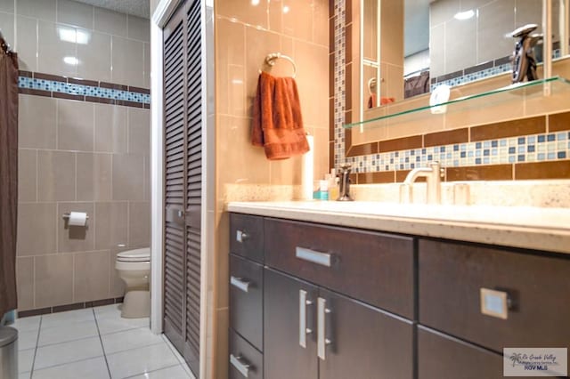 238 Starcrest Dr, Brownsville, TX 78521 - full bathroom featuring tile walls, tile patterned flooring, and vanity