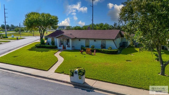 238 Starcrest Dr, Brownsville, TX 78521 - ranch-style home with a front yard and french doors