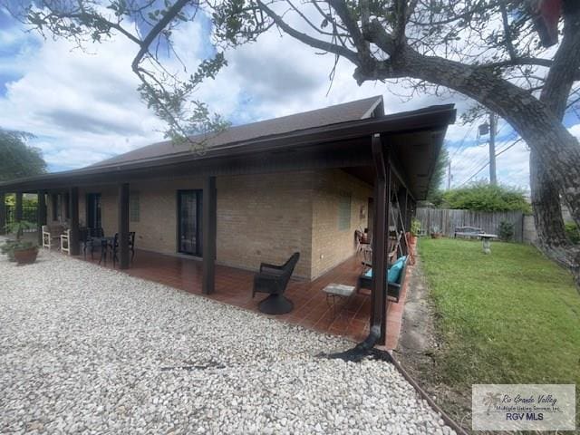 201 Terrace Ln, Harlingen, TX 78550 - view of home's exterior featuring brick siding