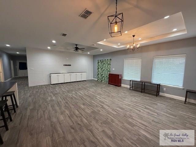 201 Terrace Ln, Harlingen, TX 78550 - interior space featuring a raised ceiling, baseboards, wood finished floors, a ceiling fan, and recessed lighting