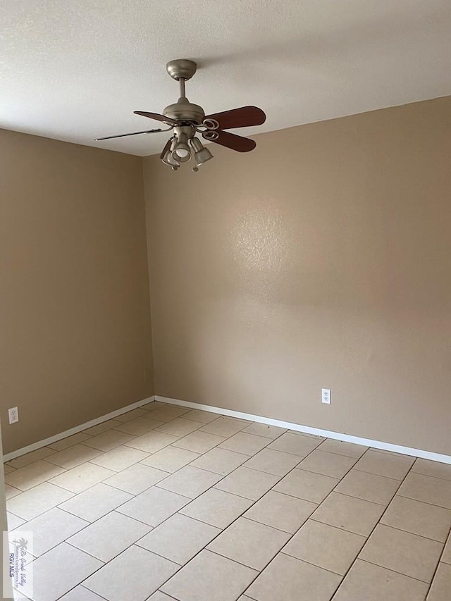 unfurnished room with light tile patterned floors, a textured ceiling, and ceiling fan