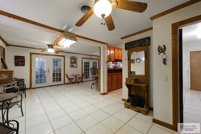 living area with visible vents, ornamental molding, a ceiling fan, and french doors