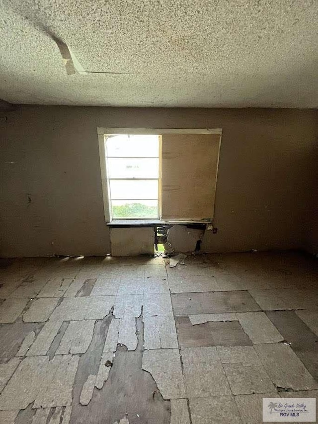 332 E 6th St, La Villa, TX 78562 - empty room with a textured ceiling