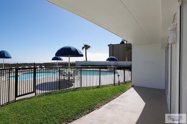 view of swimming pool with a patio