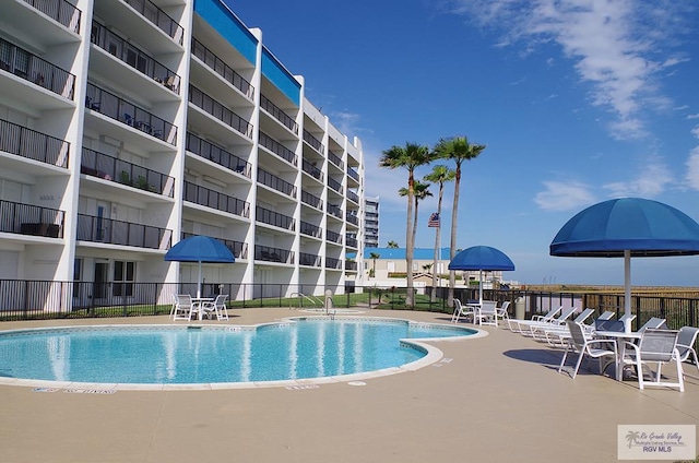 view of swimming pool with a patio