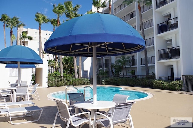 view of pool featuring a patio