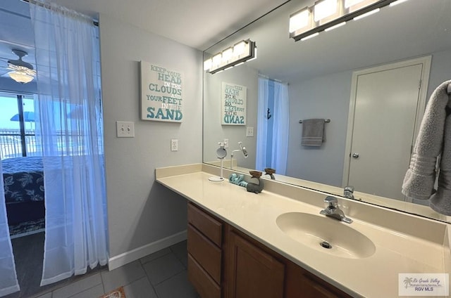 bathroom with ceiling fan, vanity, and tile patterned flooring