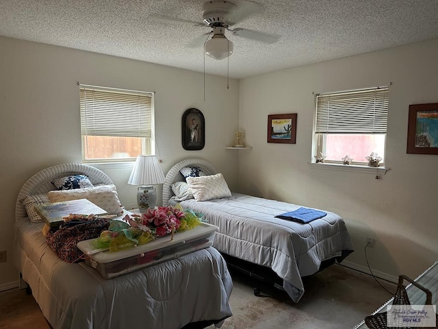 42 Cherokee Dr, Harlingen, TX 78550 - carpeted bedroom featuring a textured ceiling, ceiling fan, and baseboards