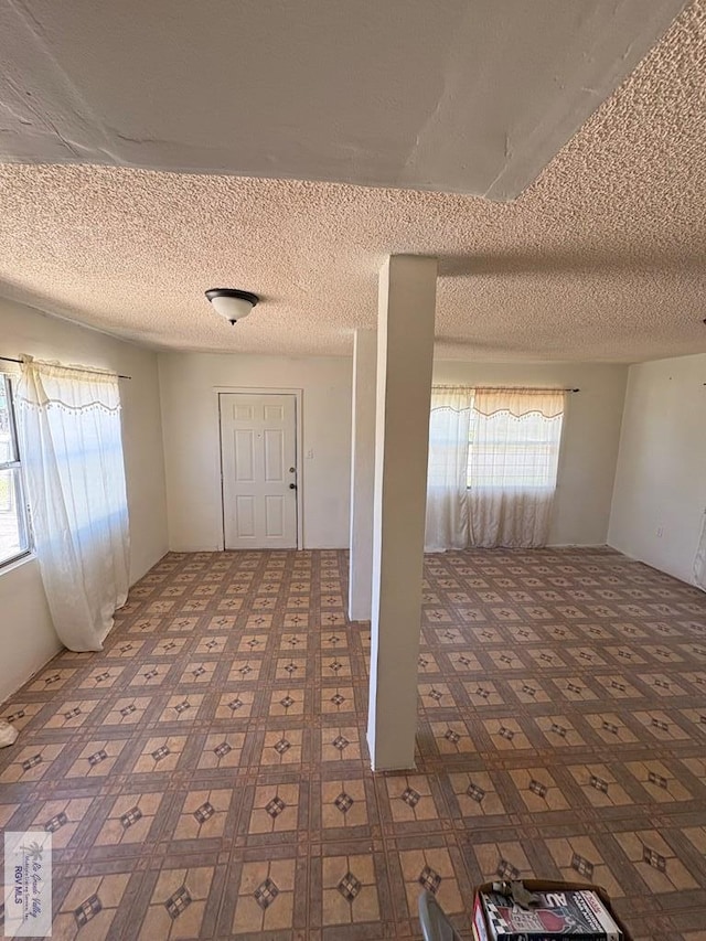 entryway with a textured ceiling