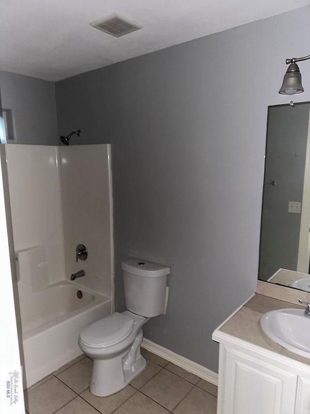 full bathroom featuring tile patterned flooring, vanity, toilet, and shower / washtub combination