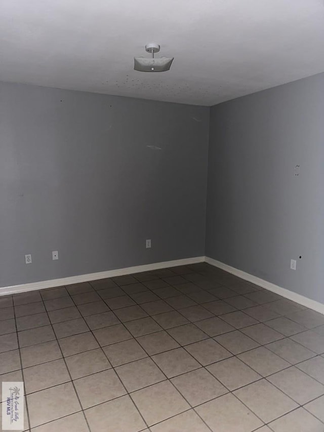 unfurnished room with light tile patterned floors