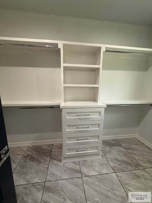 7377 San Andres St, Brownsville, TX 78520 - spacious closet featuring marble look tiles
