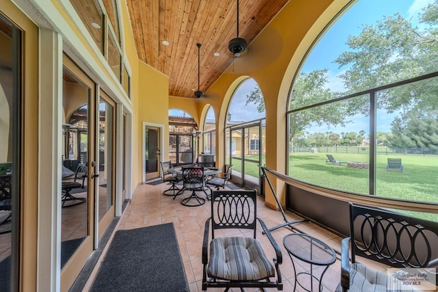 sunroom / solarium featuring recessed lighting, wood ceiling, french doors, and tile patterned floors