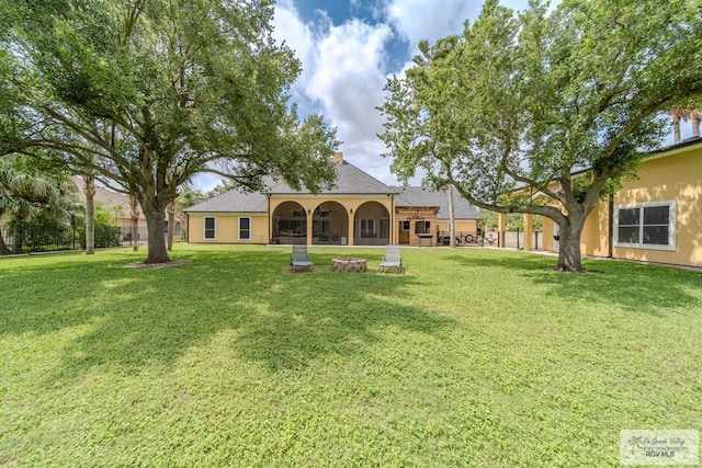 back of house with a yard