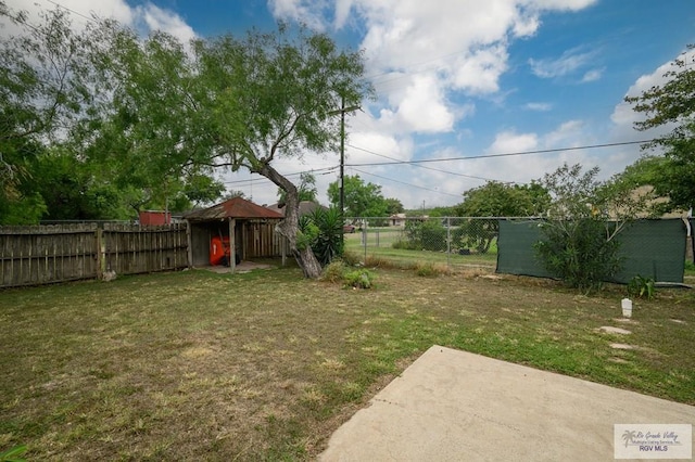 view of yard with a fenced backyard