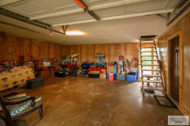 garage featuring wooden walls