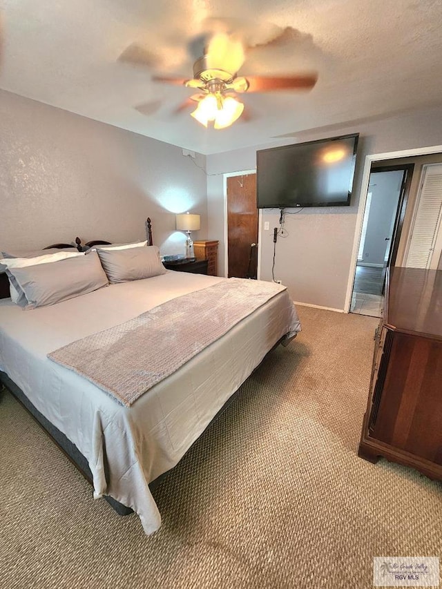 480 Madrid Ct, San Benito, TX 78586 - bedroom featuring light colored carpet and a ceiling fan