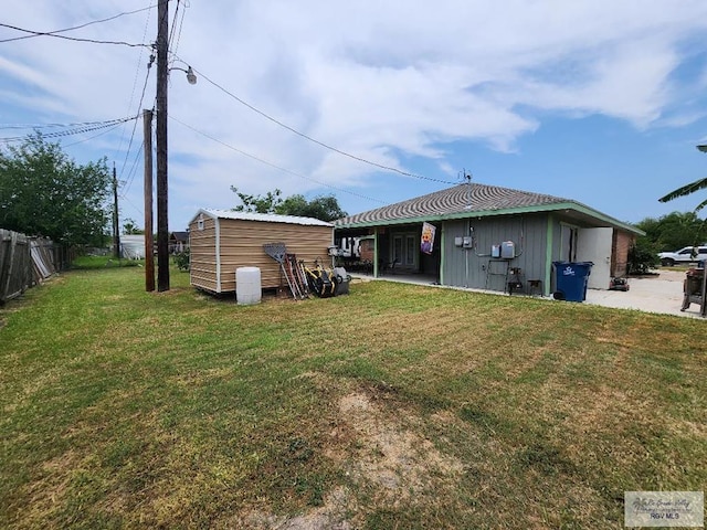 480 Madrid Ct, San Benito, TX 78586 - rear view of house with board and batten siding