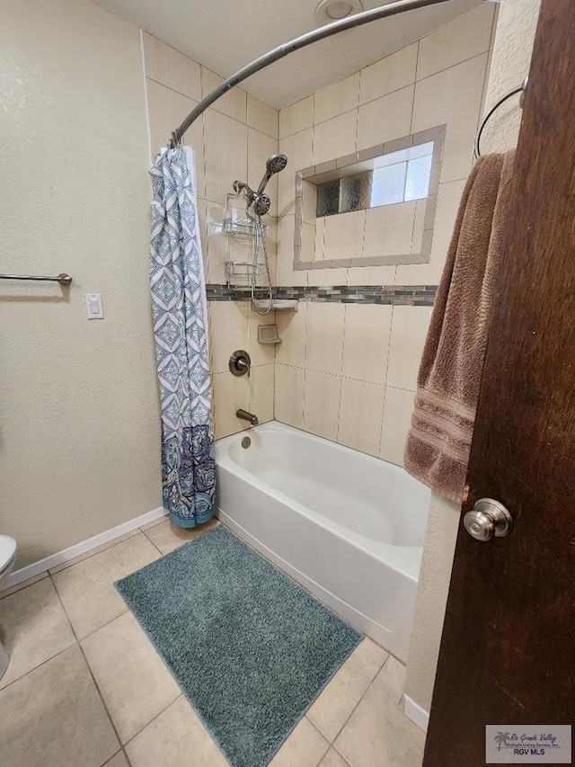 480 Madrid Ct, San Benito, TX 78586 - bathroom featuring tile patterned floors, shower / tub combo, baseboards, and toilet