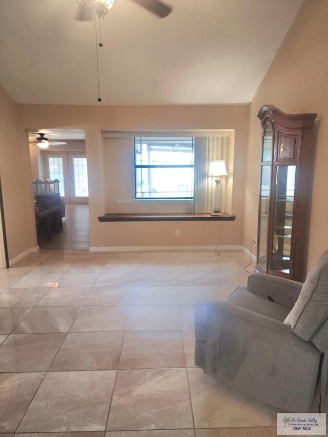 480 Madrid Ct, San Benito, TX 78586 - living area featuring a ceiling fan, baseboards, and light tile patterned flooring