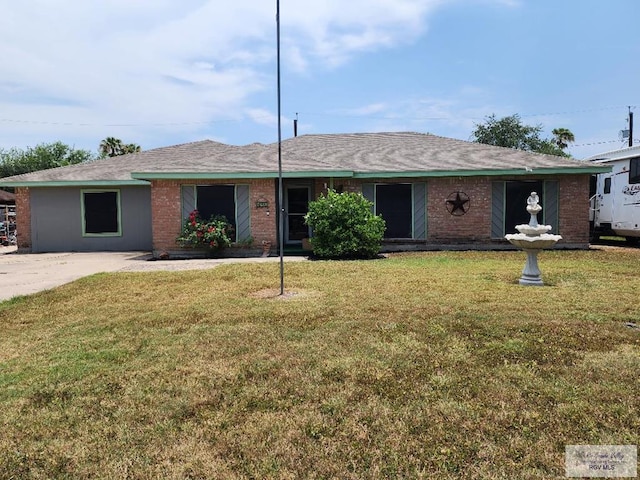 480 Madrid Ct, San Benito, TX 78586 - ranch-style home featuring a front lawn and brick siding