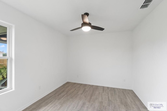 unfurnished room with ceiling fan and light hardwood / wood-style floors