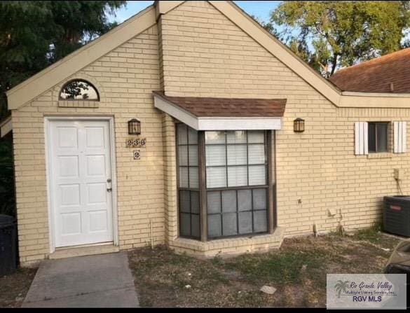 doorway to property featuring central AC