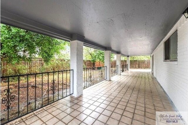 view of patio / terrace featuring fence