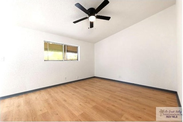 unfurnished room with light wood-style flooring, ceiling fan, and baseboards