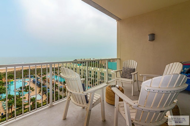 balcony featuring a water view