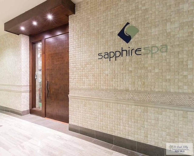 310A Padre Blvd Unit 803, South Padre Island, TX 78597 - hallway with tile walls and recessed lighting