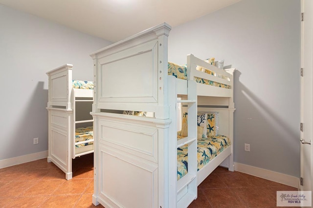310A Padre Blvd Unit 803, South Padre Island, TX 78597 - bedroom featuring light tile patterned floors and baseboards