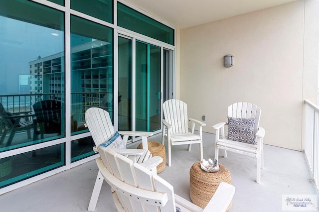 view of patio featuring a balcony