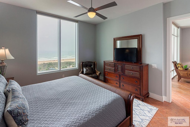 310A Padre Blvd Unit 803, South Padre Island, TX 78597 - bedroom featuring light tile patterned flooring and a ceiling fan