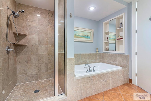 bathroom featuring tile patterned flooring and plus walk in shower