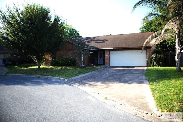 single story home with a garage and a front lawn