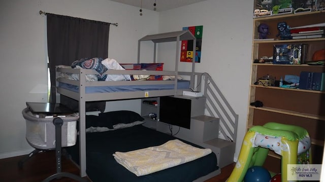 bedroom featuring wood-type flooring