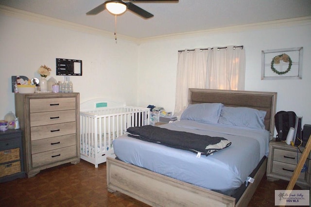 bedroom with ceiling fan and crown molding