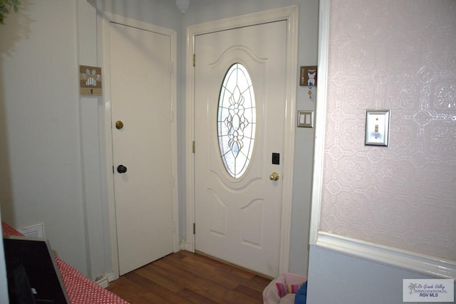 foyer entrance with hardwood / wood-style flooring