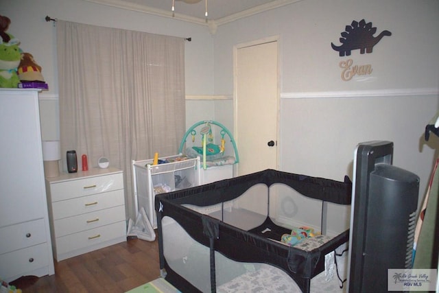 bedroom featuring dark hardwood / wood-style flooring and crown molding