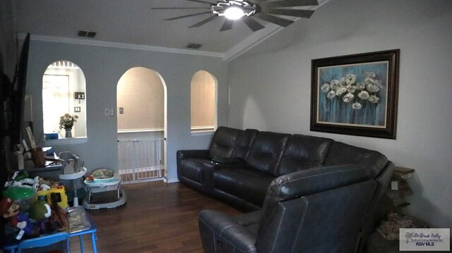 living room with ceiling fan, crown molding, vaulted ceiling, and hardwood / wood-style flooring