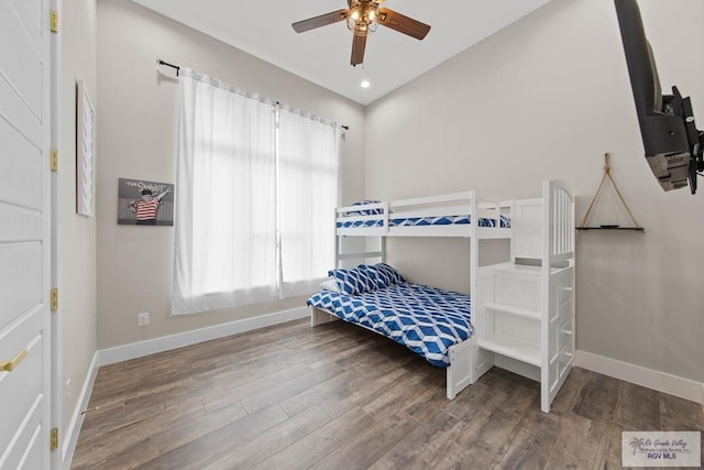 bedroom with baseboards, ceiling fan, wood finished floors, vaulted ceiling, and recessed lighting