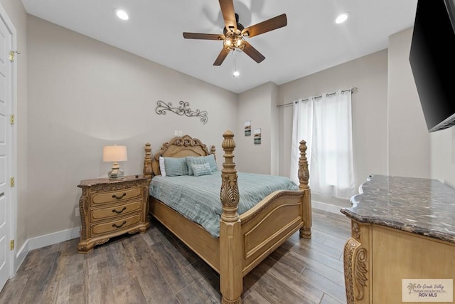 bedroom featuring a ceiling fan, baseboards, dark wood-type flooring, and recessed lighting