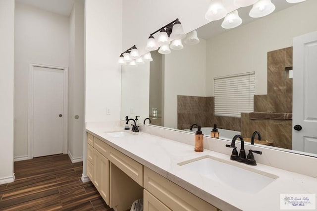 bathroom with vanity and wood-type flooring