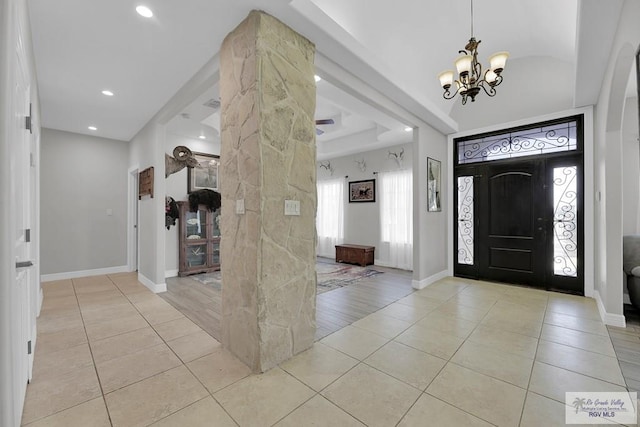 foyer entrance featuring light hardwood / wood-style floors and a notable chandelier